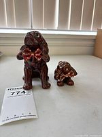 Front view of both ceramic dog figurines
