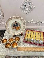 Entire lot: JFK plate, six cups, six spoons in box