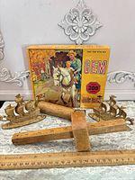 Full lot overview: puzzle box, wooden mallet, marking gauge, pair brass ship bookends