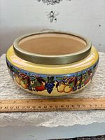 Side view showing full body decoration and metal rim