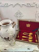 group shot of vase, cruet and boxed spoons