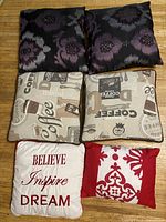 Six assorted 15x15 decorative pillows arranged in two columns of three