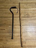 Full view of cane and walking stick side by side