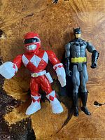 Front view of Batman and Red Power Ranger figures