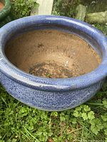 Overall view of the blue ceramic planter pot showing color, glaze, and interior