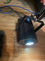 Perspective showing entire stage light with lens illuminated