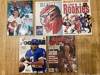 All five sports magazines laid out showing front covers