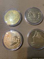 Fronts: Bitcoin symbol, Morgan eagle, Beatles logo, Titanic ship