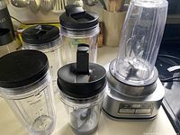 Overall view of motor base with four cups and lids