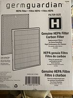 Front of sealed GermGuardian filter box displaying model, size, and illustrations of filters
