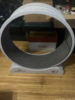 Front view of HomeGroove cat exercise wheel on base