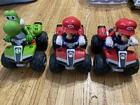 Front angled view of three RC quad vehicles