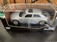 Front-left view of boxed Motormax 1:24 Chrysler 300C model