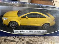 Front of boxed yellow 1:18 die-cast 2003 Honda Accord Custom Tuner