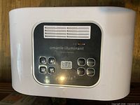Front of Omanle Illuminant showing control panel and branding