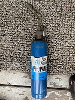 Overall view of blue Fast Flame propane cylinder with attached torch head