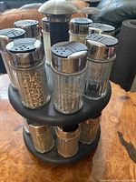Full view of rotating spice rack with jars