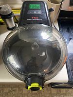 Top view showing digital control panel, clear lid, overall appliance