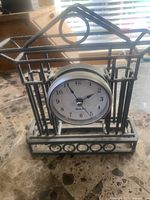 Front view of Westclox tabletop clock in metal frame