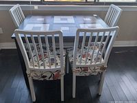 Table and four chairs overall view