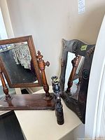 Two mirrors and candlesticks overview