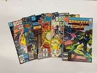 All six Booster Gold comics fanned out