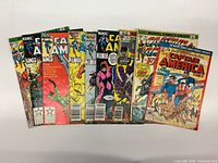 Front view showing all nine bagged comics fanned out