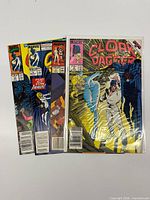 Five comics visible including bagged Limited Series #2 and others fanned