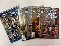 Overview of all six bagged comics fanned out