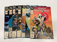 All seven comic issues fanned out showing covers and issue numbers