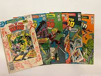 All six Adventure Comics issues fanned out showing covers and issue numbers
