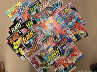 Group shot of all Flash comics spread out showing cover art and count