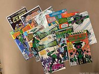 Group shot of all twelve Green Lantern comic books fanned out
