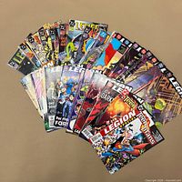 Fanned display of entire comic lot showing covers