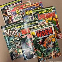 All eight comics fanned out showing front covers