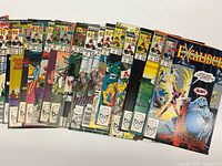 Front covers of Excalibur comic book lot fanned out