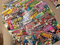 Spread of all Fantastic Four comics laid out in three staggered rows