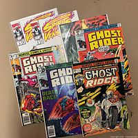 All seven Ghost Rider comics fanned out showing covers and cover prices