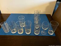Overview of all 11 glass pieces on blue cutting mat