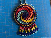 Light-blue-center medallion showing spiral pattern and tassel fringe