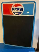 Front view showing Pepsi logo header and full chalkboard