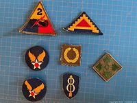 Front view of all seven patches laid out on grid mat