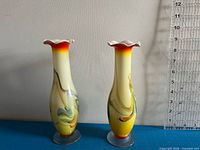 Front view of both vases showing color pattern and ruffled rims