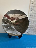 Front view of plate showing landscape scene