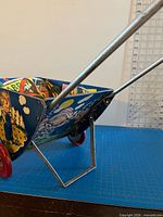 Side view showing litho graphics, aluminum handle, kickstand deployed