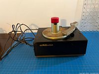 Overall view showing turntable, spindle, tonearm and RCA Victor logo