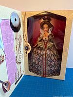 Open lid view showing mint Elizabethan Queen Barbie doll inside window box