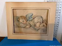 Linen-toned paper mat holding lithograph print