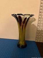 Full view of vase front showing colors and scalloped rim