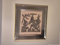 Full framed Thai rubbing artwork hung on wall